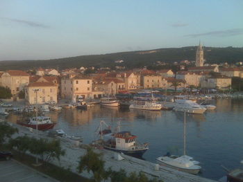 Boats moored at harbor