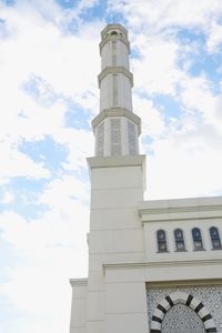 Low angle view of clock tower against sky