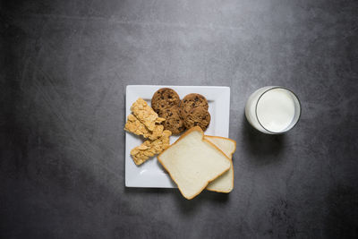 High angle view of cookies and coffee on table