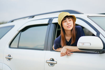 Portrait of woman sitting in car