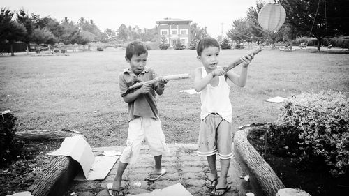 Boy playing with umbrella