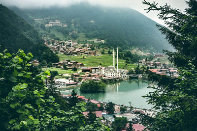 High angle view of townscape by river