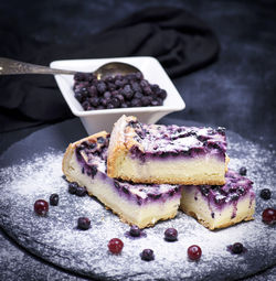 Close-up of cakes on slate