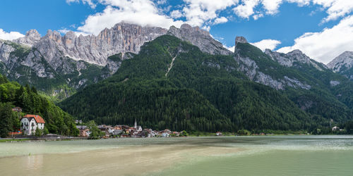 Scenic view of lake and mountains against sky