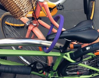 Low section of person with bicycle in basket