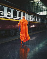 Rear view of man standing on train