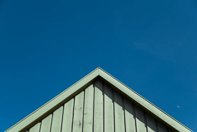 Low angle view of built structure against clear blue sky