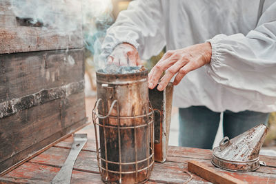 Midsection of man preparing food