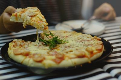 Close-up of pizza served in plate