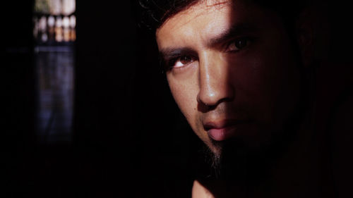 Close-up of thoughtful young man