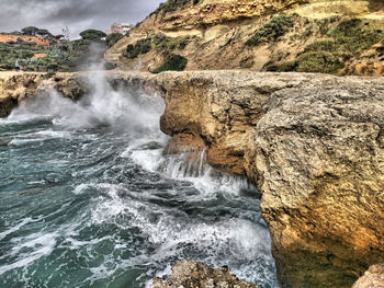 Waves flowing through rocks