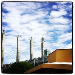 Low angle view of building against cloudy sky