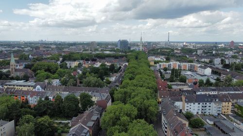 High angle view of buildings in city against sky