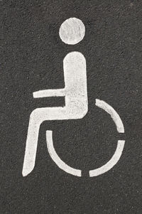 High angle view of disabled sign on road