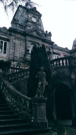 Low angle view of statue against building