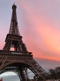 Low angle view of eiffel tower against sky during sunset