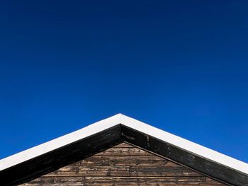 Low angle view of building against blue sky