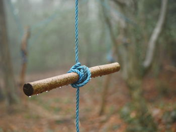 Close up of rope tied on stick