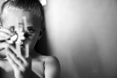 Portrait of boy holding camera