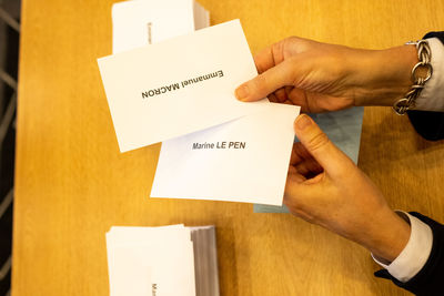 Cropped hand of person holding envelope