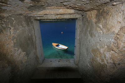 High angle view of the boat moored at turquoise see