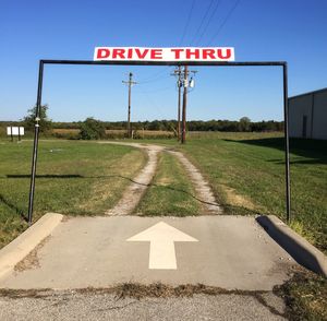 Road sign against sky