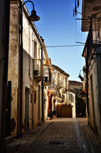 Narrow alley amidst buildings in town