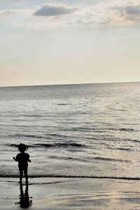 Scenic view of sea at sunset