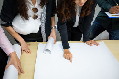 Rear view of business colleagues working at office