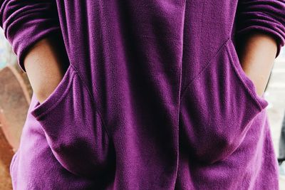 Close-up of man standing on pink petals