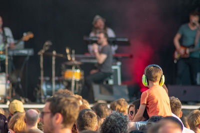 Group of people looking at music concert