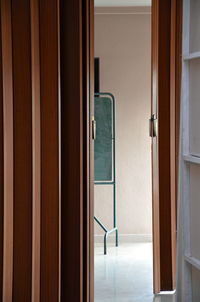 Close-up of open door of house