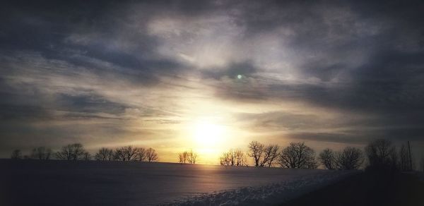 Scenic view of snow covered landscape against sky