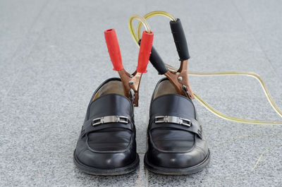 Close-up of shoes on ground