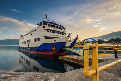 Ship moored on sea against sky