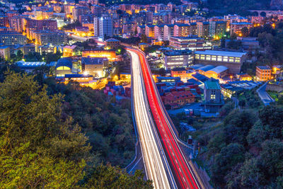 High angle view of light trails on road in city