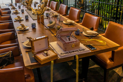 High angle view of empty chairs and tables in restaurant