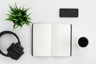 Directly above shot of coffee on table against white background