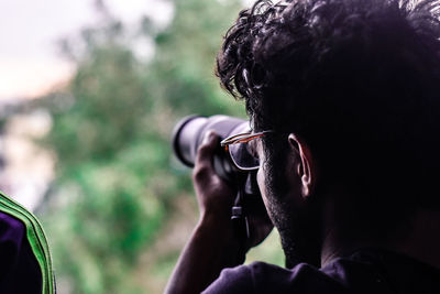 Close-up of man photographing