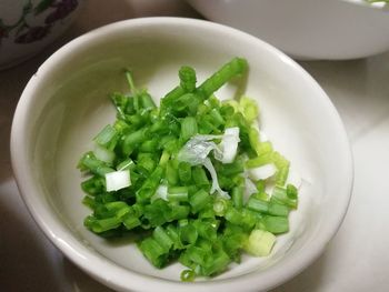 High angle view of chopped vegetables in bowl on table