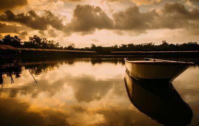 Scenic view of lake against sky during sunset