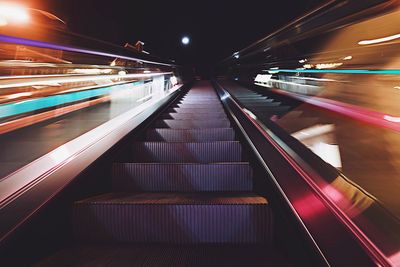 Blurred motion of illuminated subway station