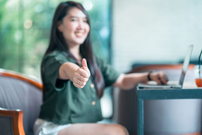Young woman using mobile phone