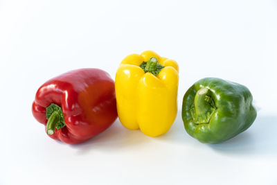 Close-up of bell peppers against white background