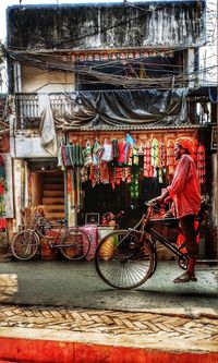 Rear view of bicycles parked on street in city