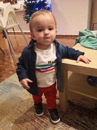 Cute boy standing at home