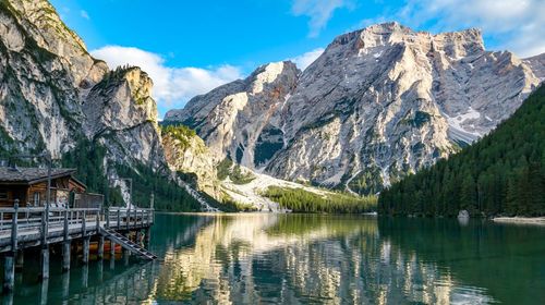 Scenic view of lake and mountains against sky