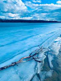 Scenic view of frozen lake against sky