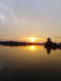 Scenic view of sunset over river