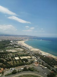 High angle view of buildings by sea against sky